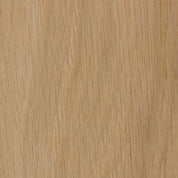 Close-up of a wooden surface with a light brown color and visible grain pattern.