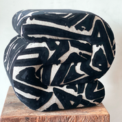 Bold C-Shaped Black & White Ottoman – Graphic Modern Pouf