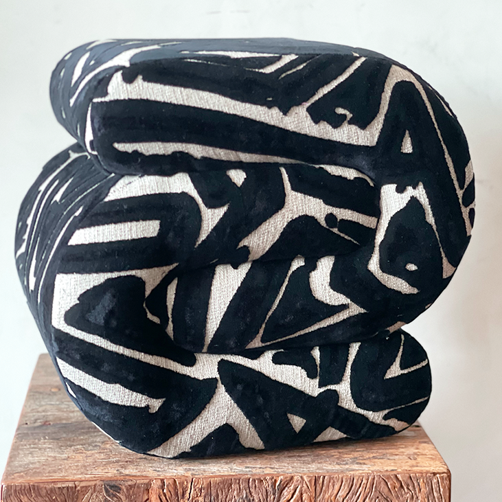 Bold C-Shaped Black & White Ottoman – Graphic Modern Pouf