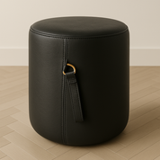 black leather pouf or foot stool with handle