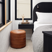black-leather-paneled-round-ottoman-modern-hf-studio
