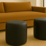 black round leather ottomans in living room with brown sofa