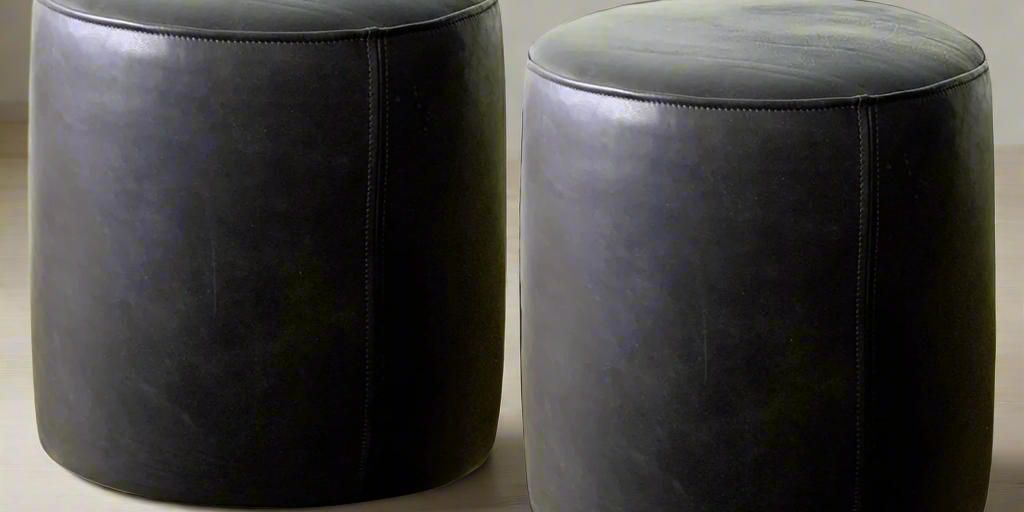 pair_of_black-leather-ottoman-pouf-round-leather-ottoman-round.png