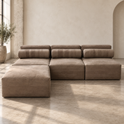 Rugged natural buffalo hide sectional sofa with stitched leather bolsters and ottoman