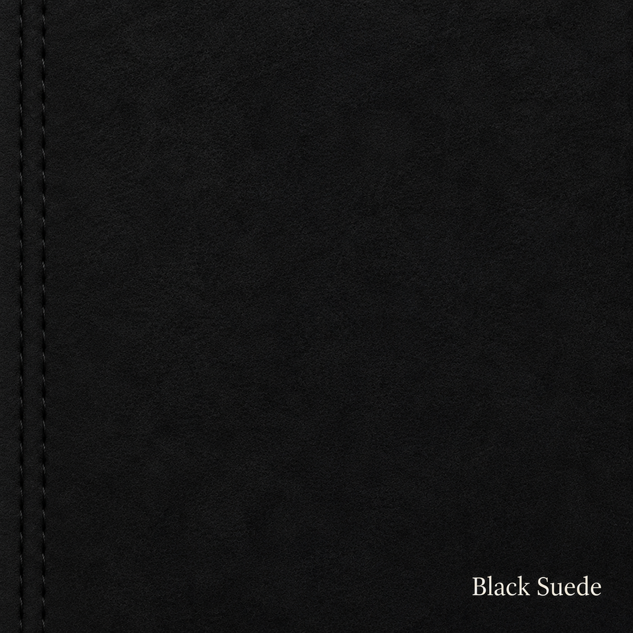 Close-up of black suede fabric with visible stitching.