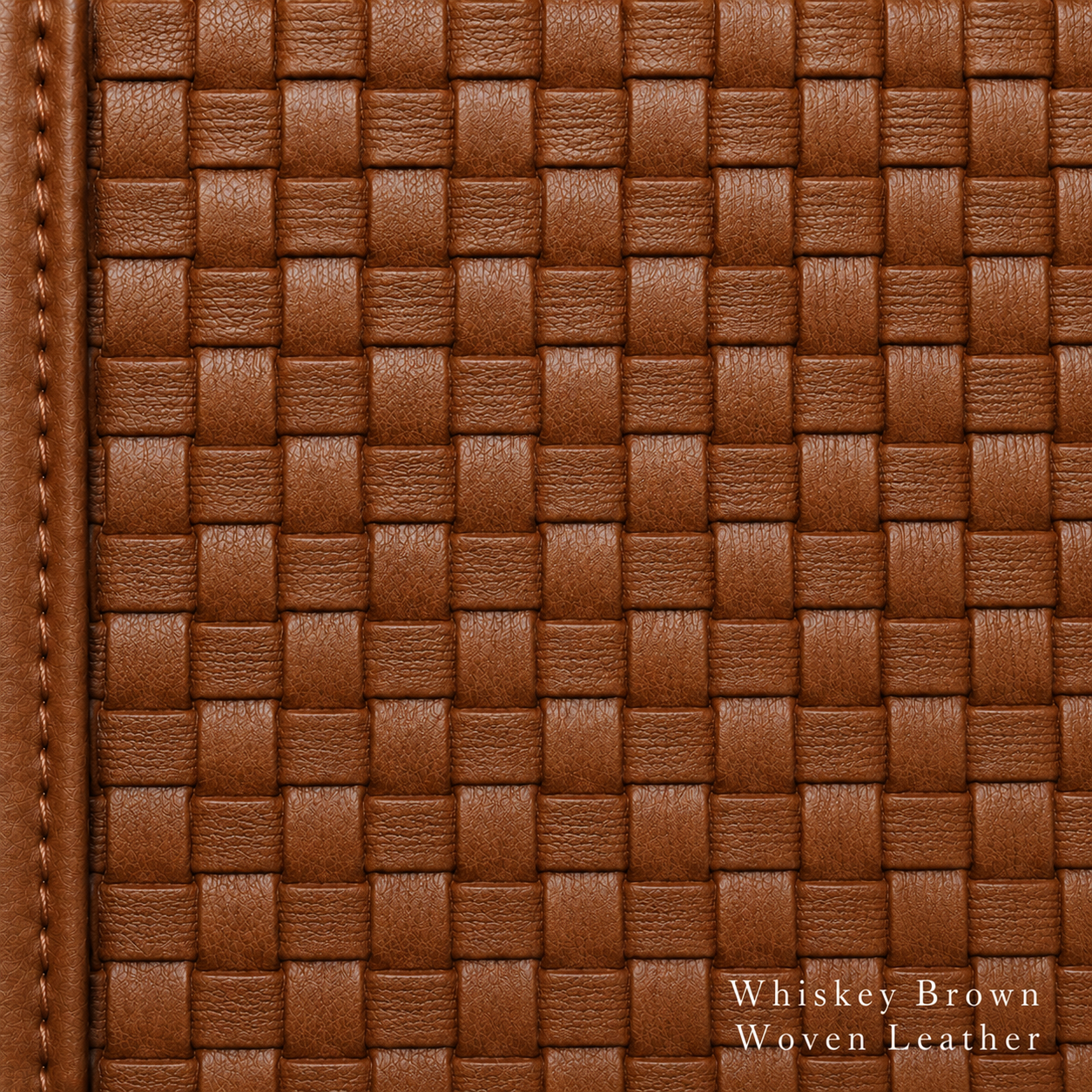 Close-up of whiskey brown woven leather with visible stitching.