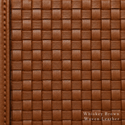 Close-up of whiskey brown woven leather with visible stitching.